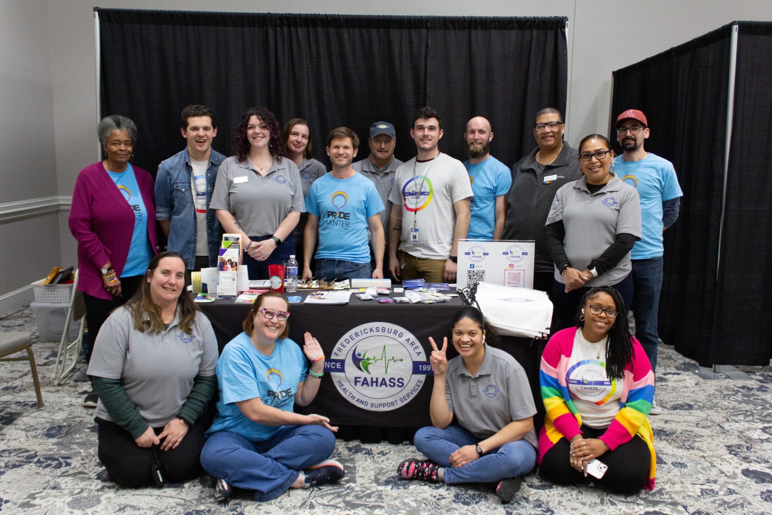 The FAHASS team poses together at a Community Connections Expo booth in Fredericksburg, VA.