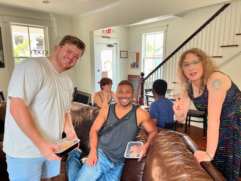 Cheerful group of diverse friends enjoying a monthly brunch at Rehana's, hosted by FAHASS' Pride Center in Fredericksburg, VA.