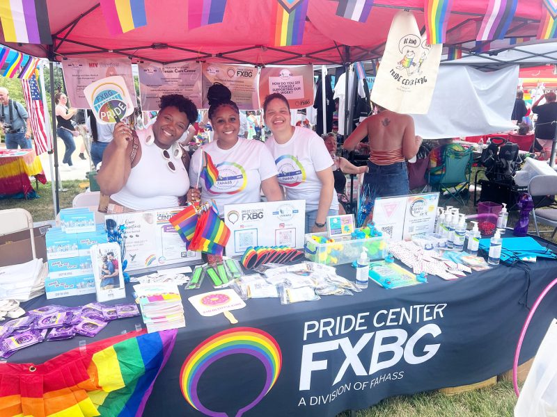 Group of Pride volunteers running the Pride Center FXBG table at Fredericksburg Pride Fest 2024
