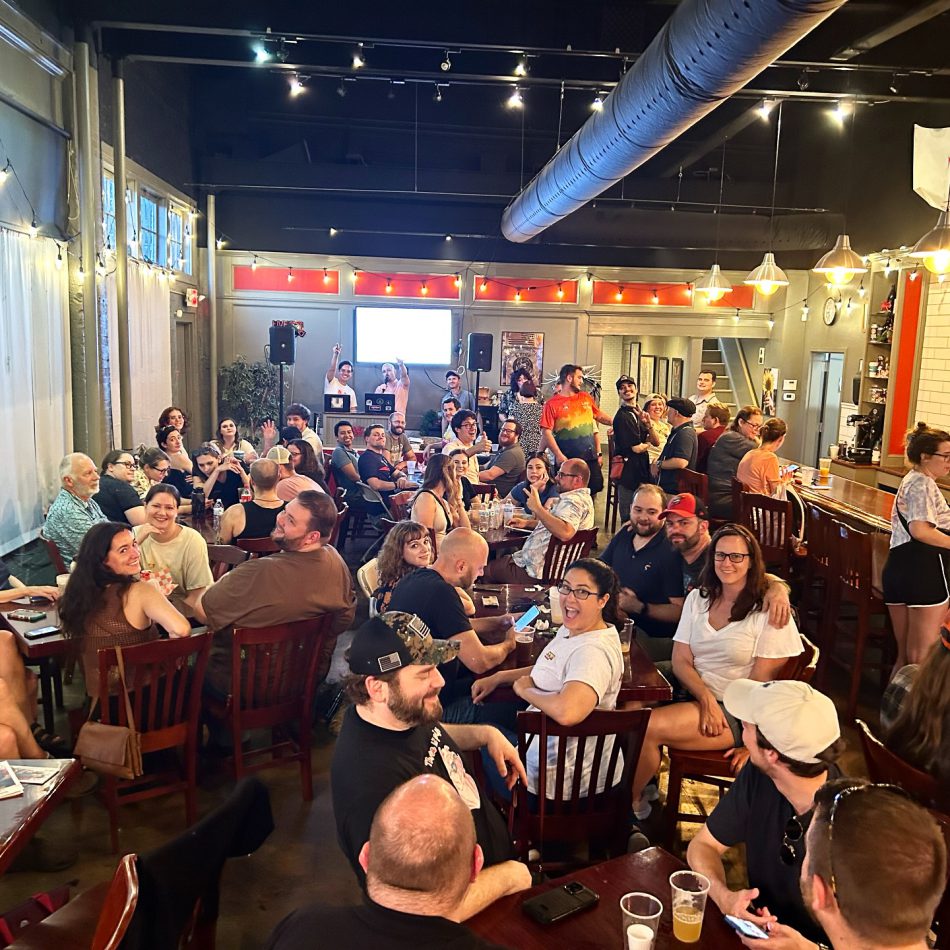 A packed house at Red Dragon Brewery with lots of happy people playing Pride Trivia by Pride Center FXBG in Fredericksburg, VA.