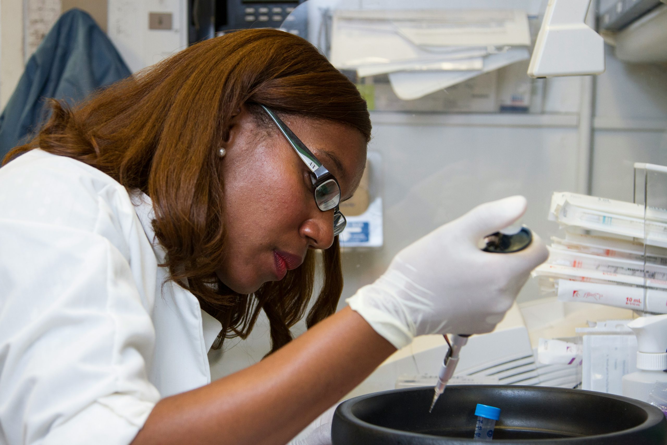 A medical professional conducting laboratory tests, representing the on-site lab services available at Mosaic Care Center for convenient patient care.