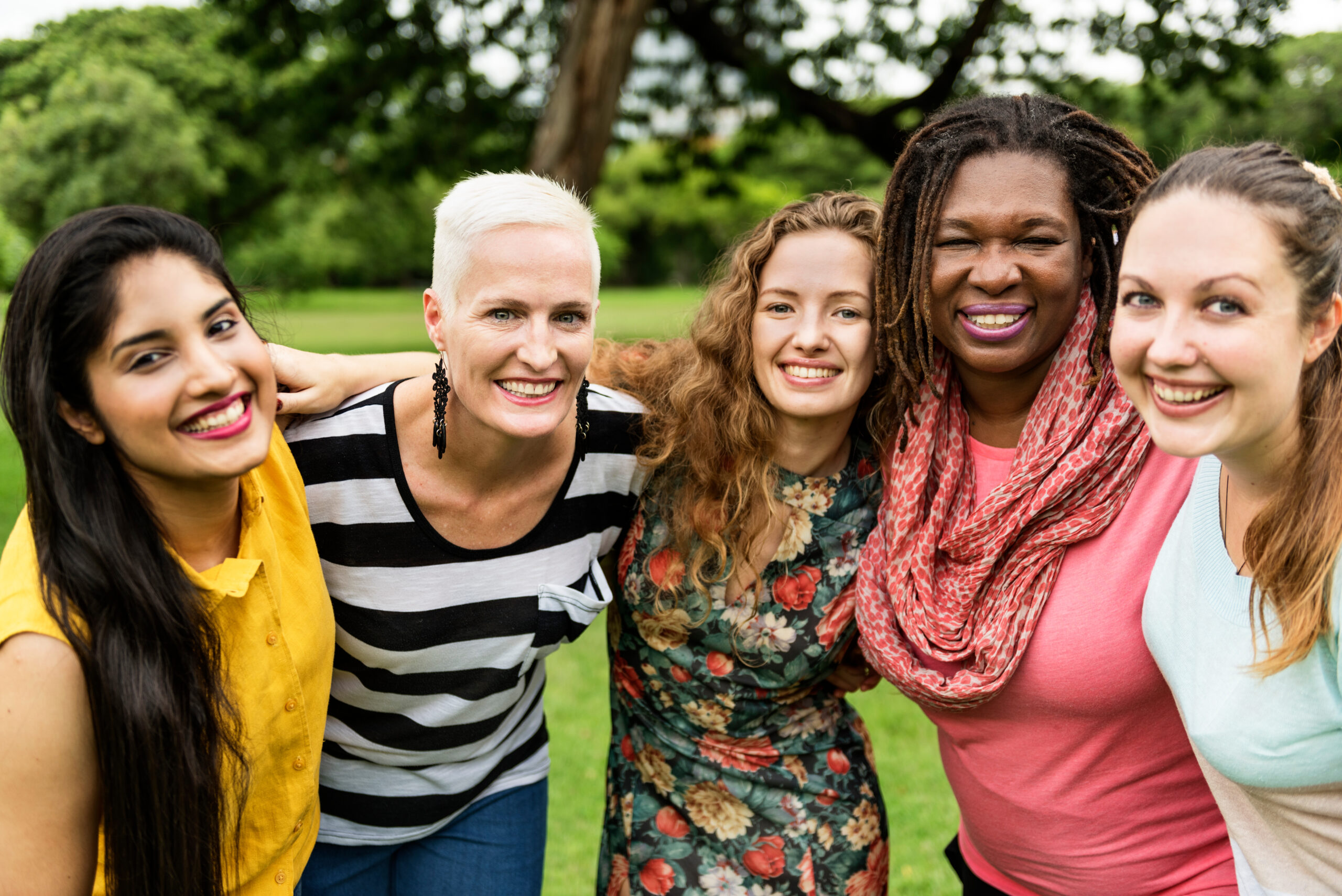 Group of diverse women together, symbolizing the inclusive and supportive environment of the Lesbian & Bi Women’s Group at Pride Center FXBG.